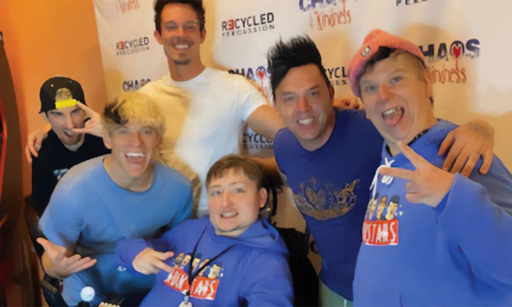 Ryan, center, surrounded by members of Recycled Percussion.