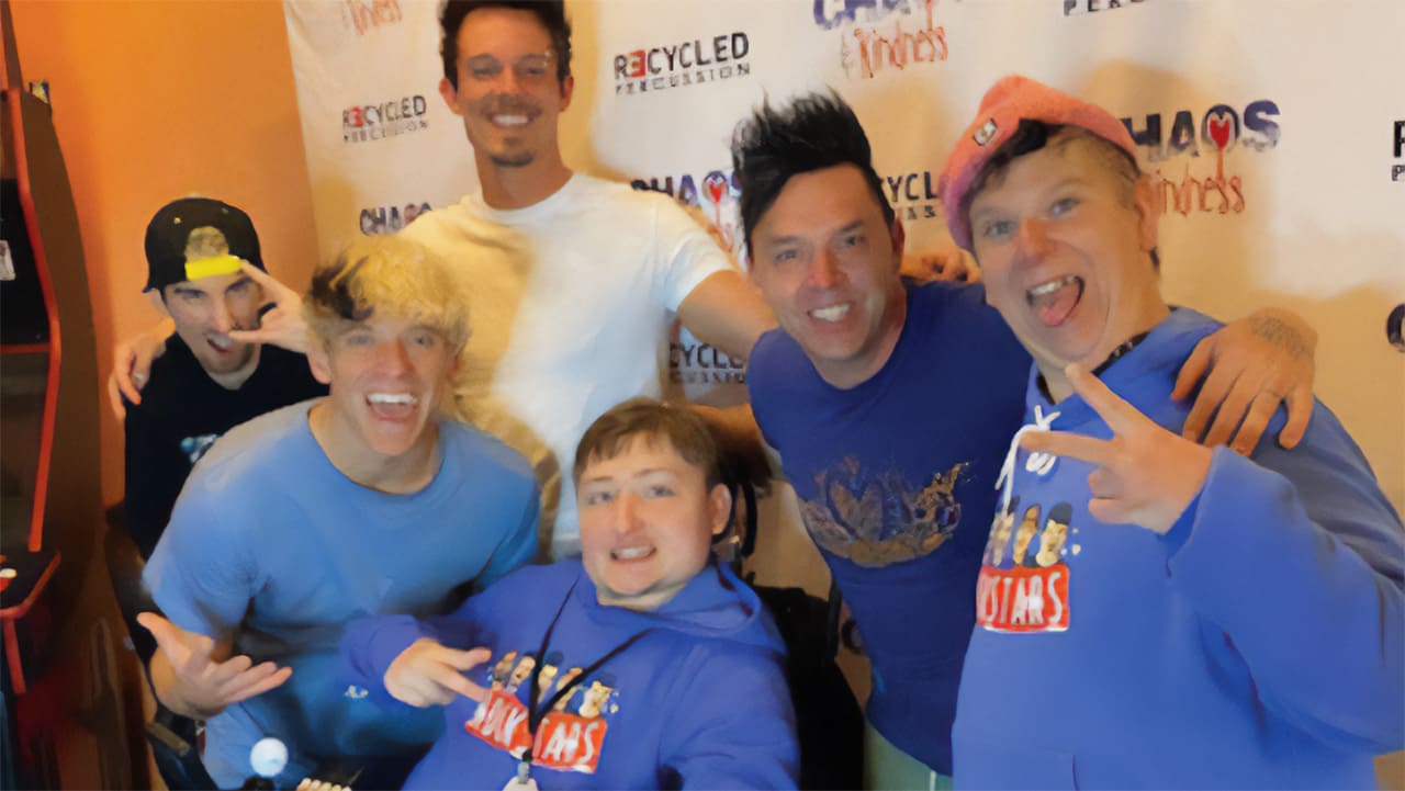 Ryan, center, surrounded by members of Recycled Percussion.