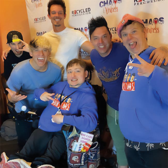 Ryan, center, surrounded by members of Recycled Percussion.