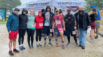 Travis Smith, center, wearing bib 238, at a Veterans Count Pack & Boots Road Race.