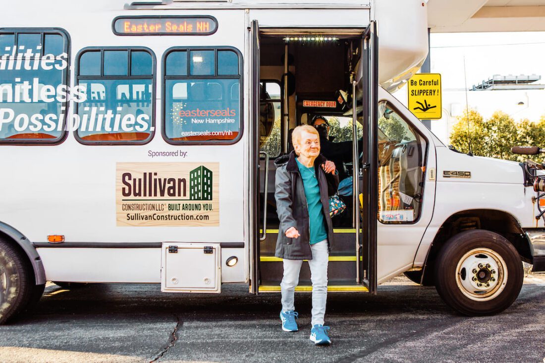 Woman walking off Easterseals NH bus.