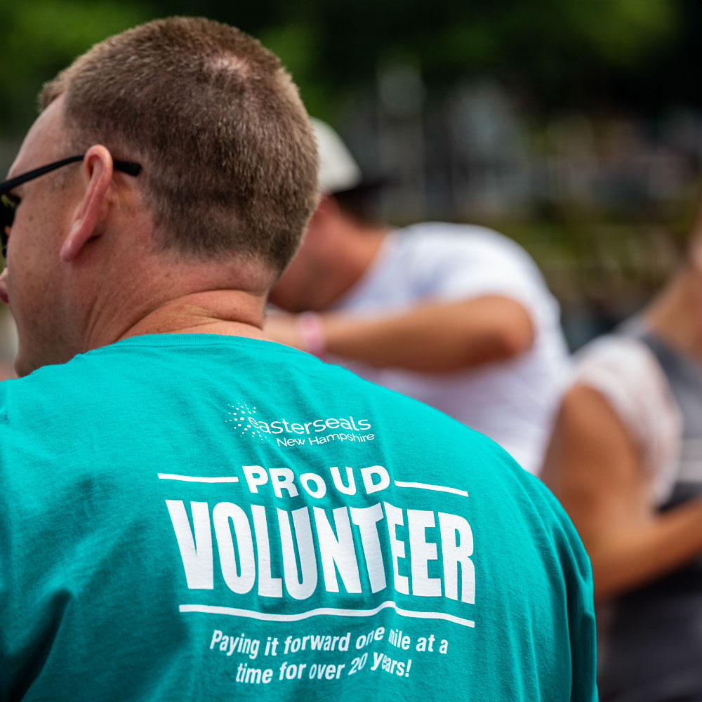 Easterseals NH volunteer wearing a shirt that reads, "proud volunteer."