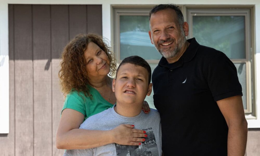 Hunter—pictured here with his parents, Stephanie and Frank—enjoyed a uniquely personalized experience at Camp Sno-Mo in the summer of 2023.