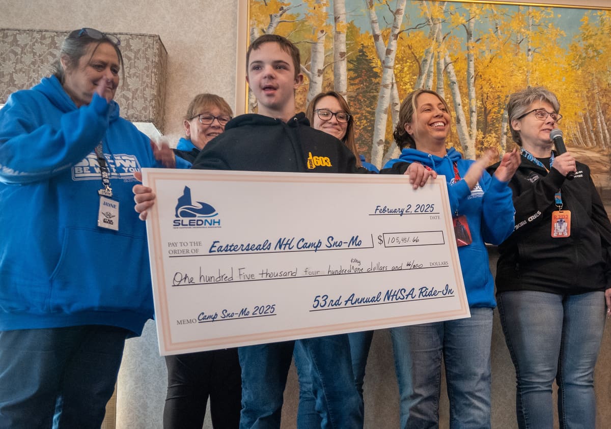 Lucas, a 2024 camper, helped present the check at the conclusion of the event.