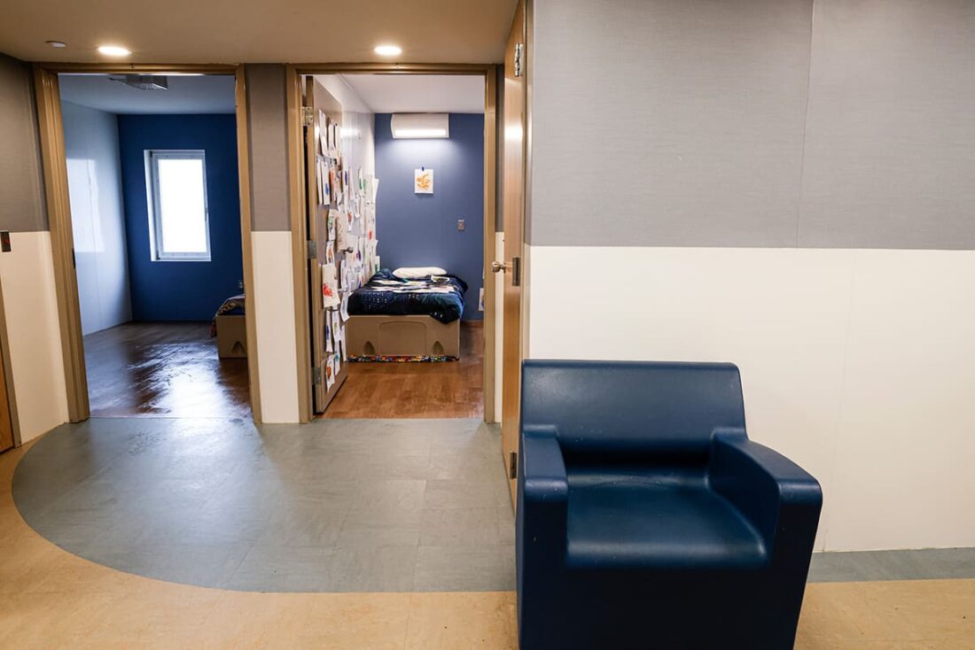 Hallway at Gammon academy at Zachary Roads residential building showing doorway to a bedroom
