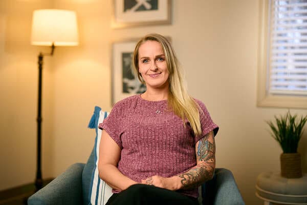 Woman clinician sitting in chair