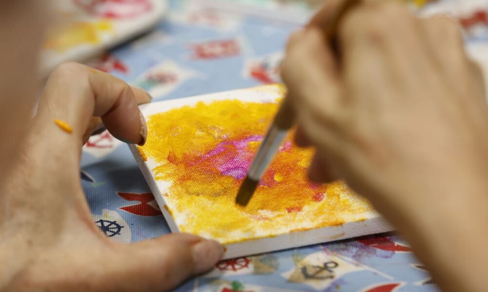 adult day participant painting close up