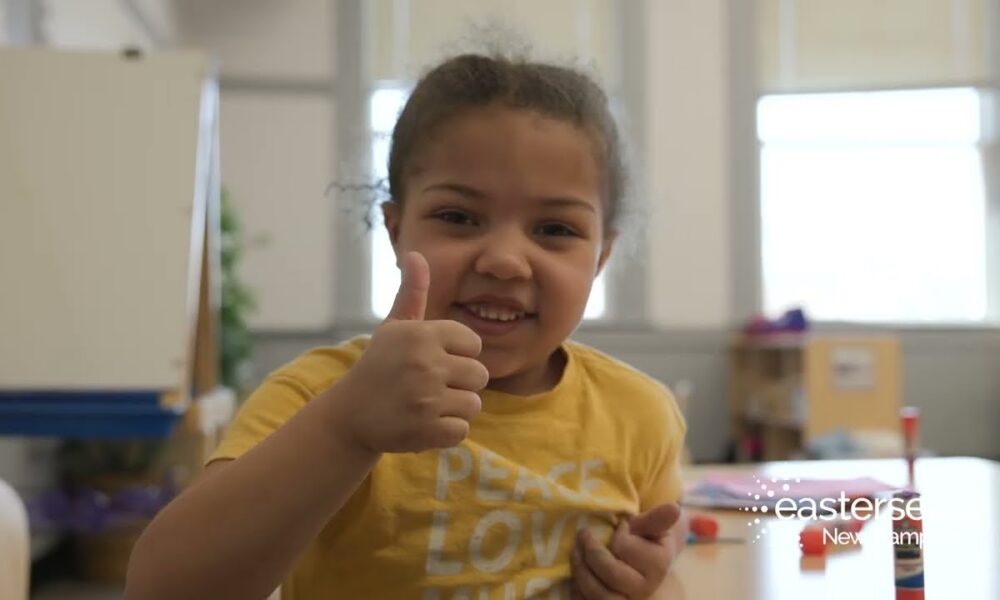 Young girl giving a thumbs up