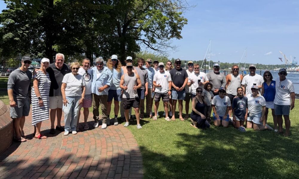 Group photo featuring anglers, volunteers, and event organizers of the Striped Bass Tournament