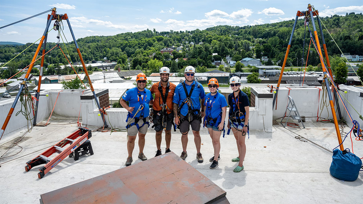 Photo of the Over the Edge and Easterseals NH & VT team on the Barre Manor roof.