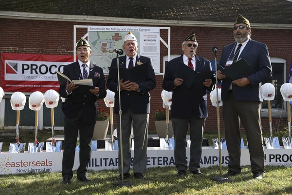 Four Army veterans singing at the Military & Veterans Campus groundbreaking event